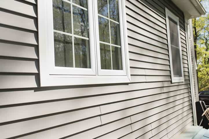 long island residential property with grey vinyl siding.